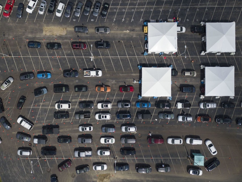 caption: The pandemic appears to have peaked or be on the verge of peaking, with cases projected to slowly decline this fall and winter. As recently as Sept. 8, people were waiting at COVID-19 testing site in Kentucky, where over 4,000 new cases were confirmed that day.