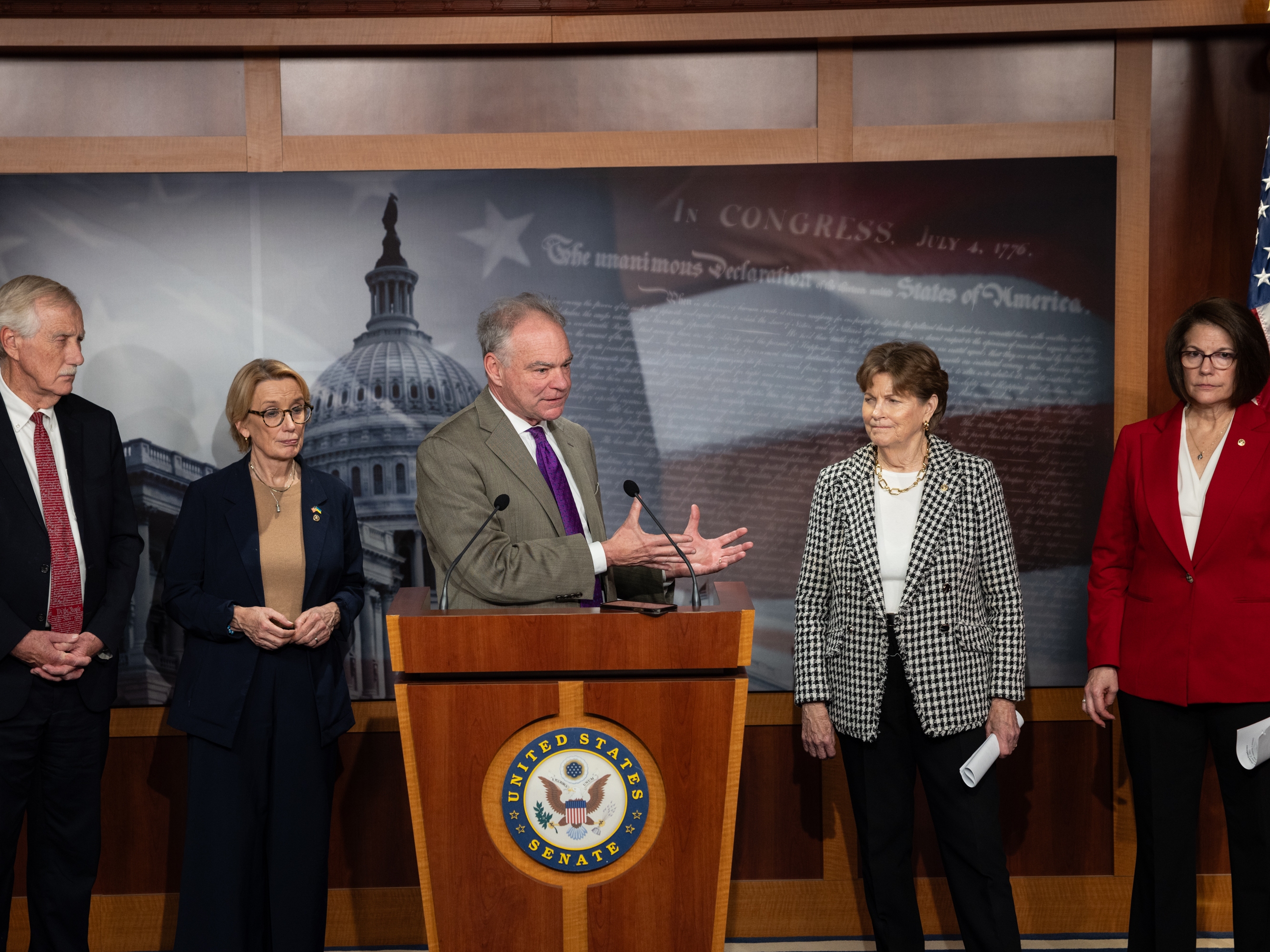 caption: Sen. Tim Kaine, D-Va., speaks during a press conference following a vote on Capitol Hill on Sunday. The Senate convened for a rare Sunday session in an attempt to end the government shutdown.