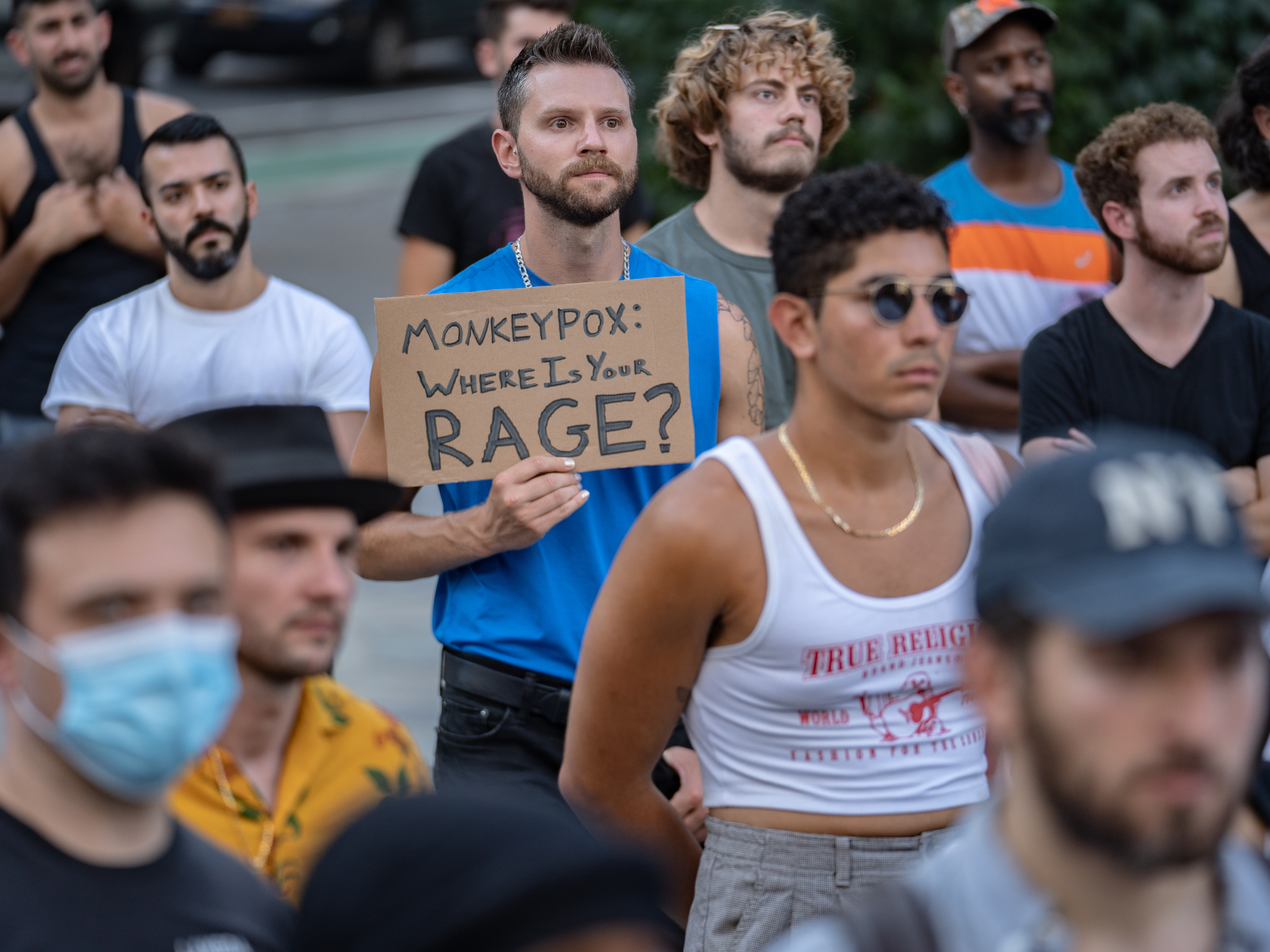 caption: People protest during a rally calling for more government action to combat the spread of monkeypox at Foley Square on July 21, 2022 in New York City.