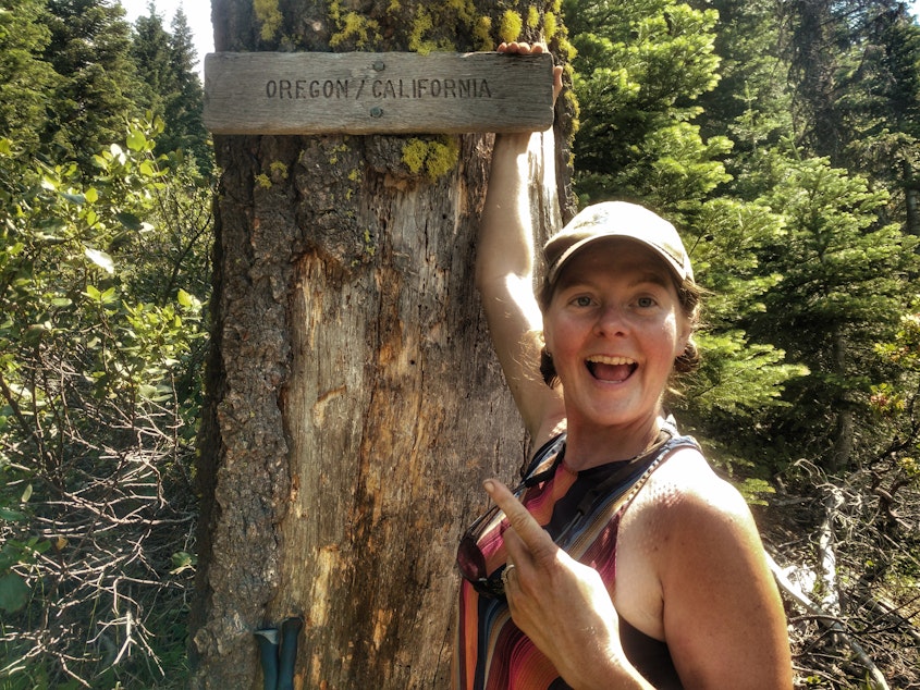 caption: Heather "Anish" Anderson on the Pacific Crest Trail at Oregon-California border.
