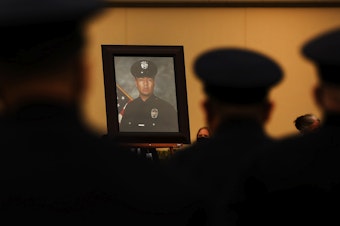caption: Colleagues, family and friends attend the August 2020 funeral of Los Angeles Police Department Officer Valentin Martinez, the agency's first sworn officer to die of complications from COVID-19.
