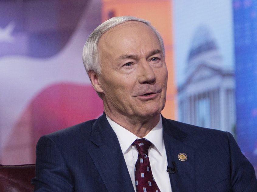 caption: Arkansas Gov. Asa Hutchinson, pictured in 2019, on Monday said the bill banning gender-affirming medical care for transgender youth would set "new standards of legislative interference with physicians and parents as they deal with some of the most complex and sensitive matters involving young people."