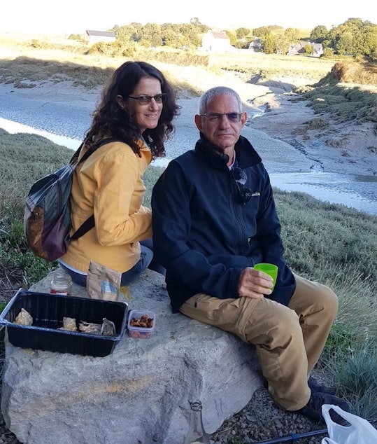 caption: Natalie Smith's aunt and uncle, Lilach and Eviatar Kipnis, in Israel, enjoying a picnic during happier times.