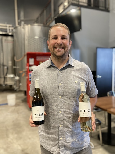 caption: Winemaker Dane Iussig of Entiat wines in northern Washington state. 

Iussig's great-grandfather brought his winemaking skills to the United States from northern Italy in the early 1900's. 

Iussig's first solo-attempt at producing wine was ruined by this year's wildfires, which smothered the grapes. Iussig says flavors of cigarette butts and cigars can be tasted in smoke-tainted wines. 
