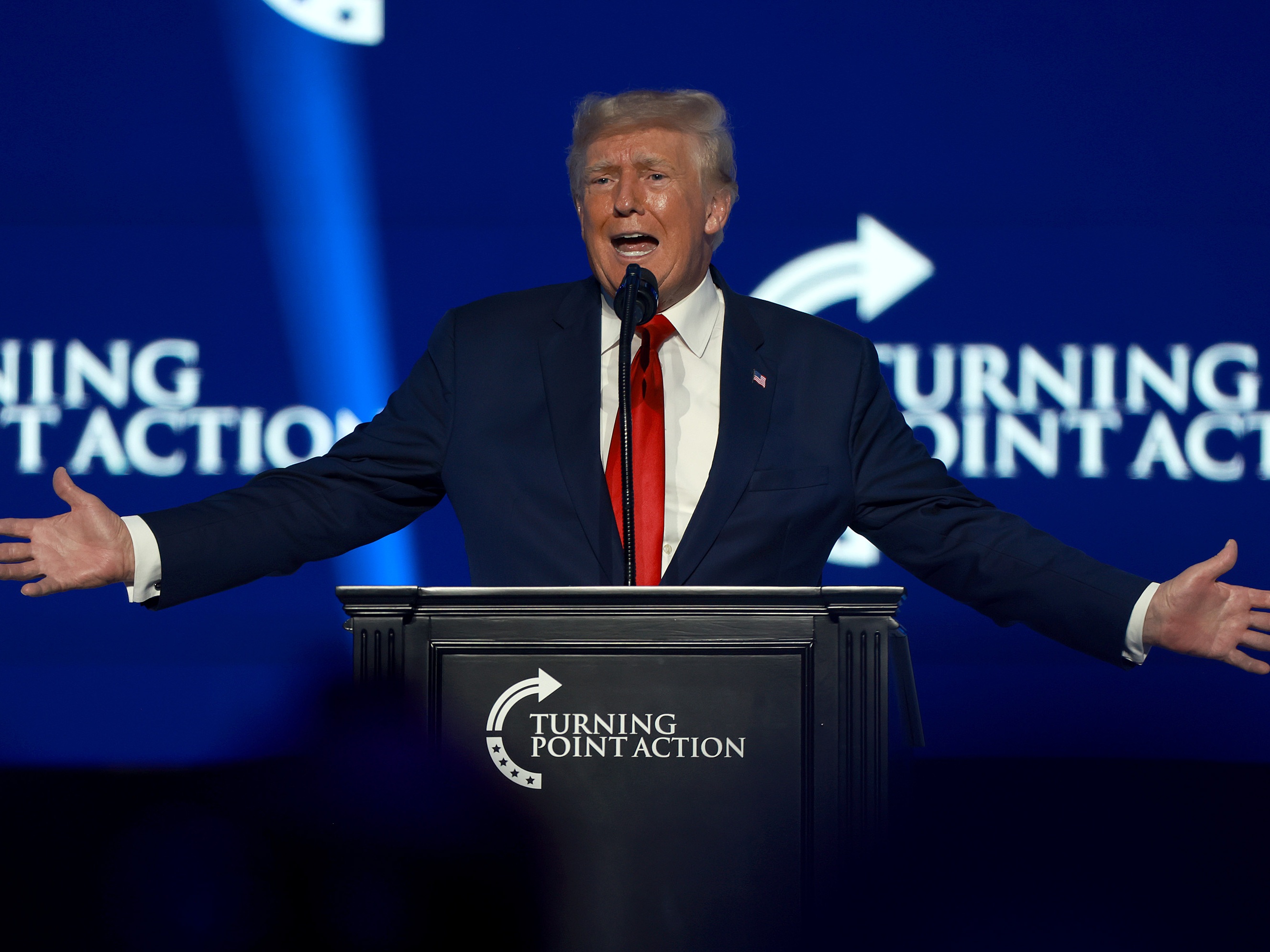caption: Former President Donald Trump speaks during the Turning Point USA Student Action Summit on Friday in West Palm Beach, Fla.