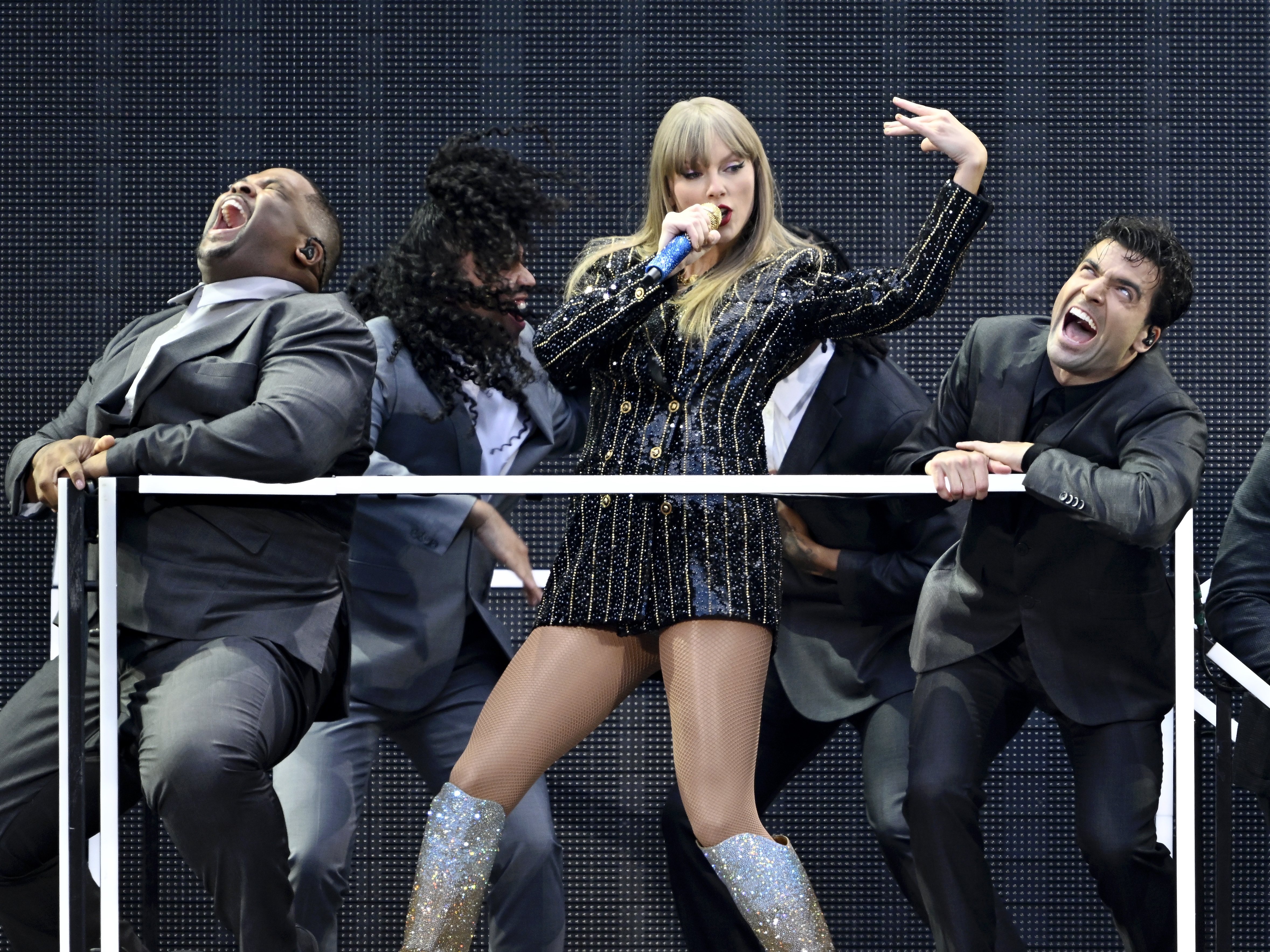 caption: Taylor Swift performs at Wembley Stadium London, England on June 21 as part of her Eras Tour. 