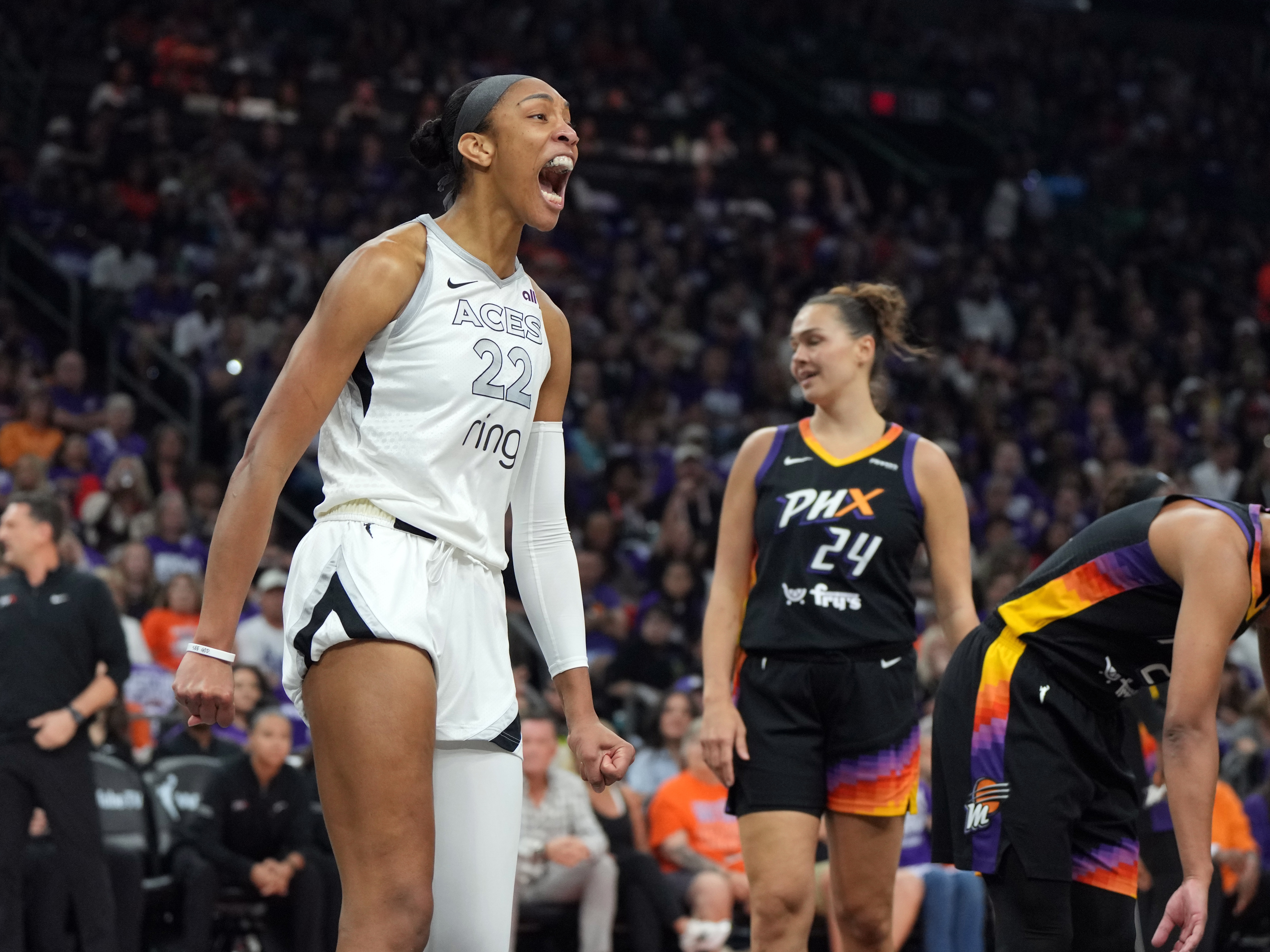 caption: Las Vegas Aces center A'ja Wilson reacts after scoring against the Phoenix Mercury during Game 4 of the WNBA basketball finals on Friday in Phoenix. Wilson scored 31 points as the Aces beat the Mercury 97-86 to sweep their way to a third championship in four seasons.
