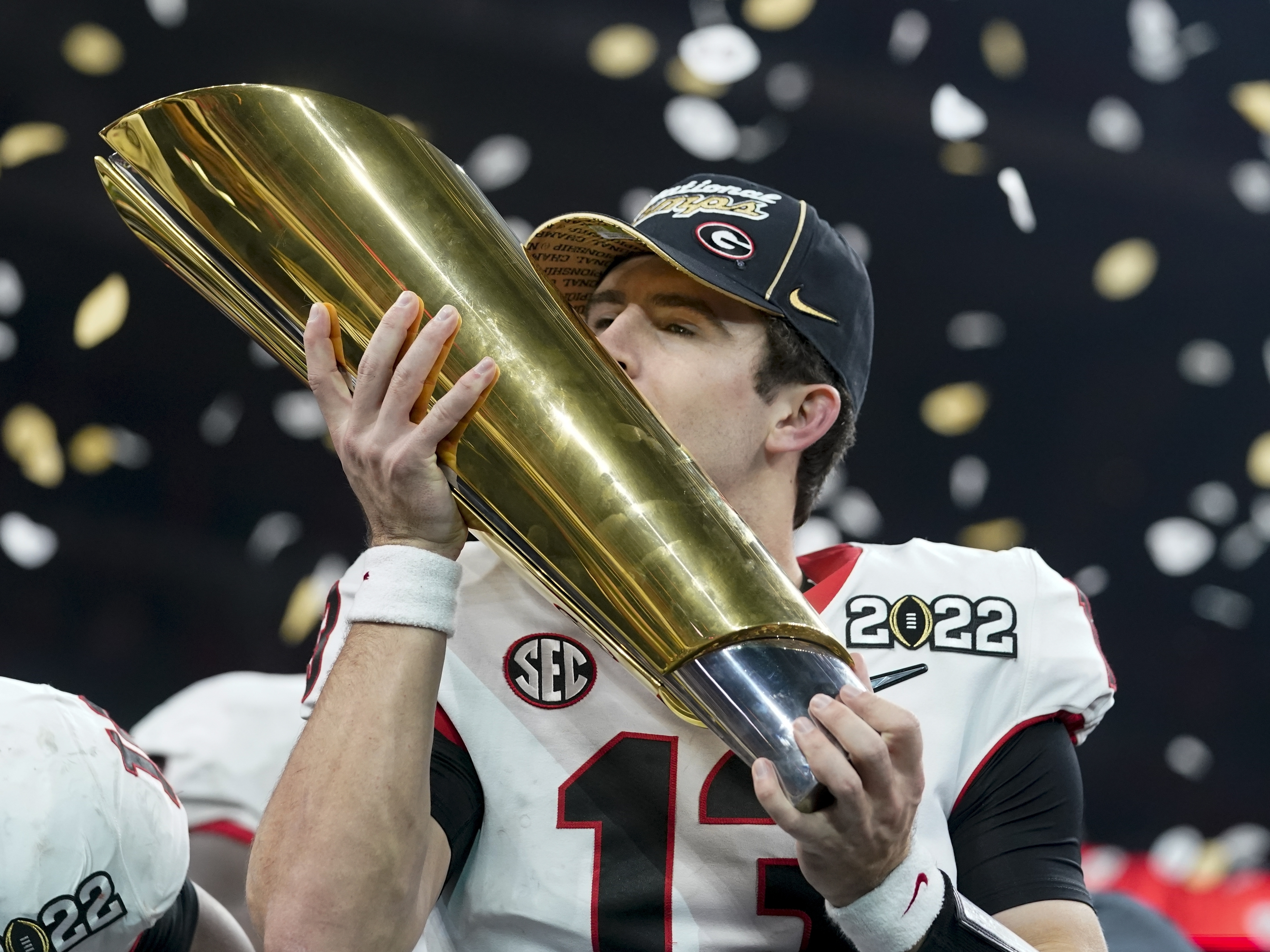 caption: Georgia's Stetson Bennett celebrates after the College Football Playoff championship football game against Alabama Tuesday in Indianapolis. Georgia won 33-18.