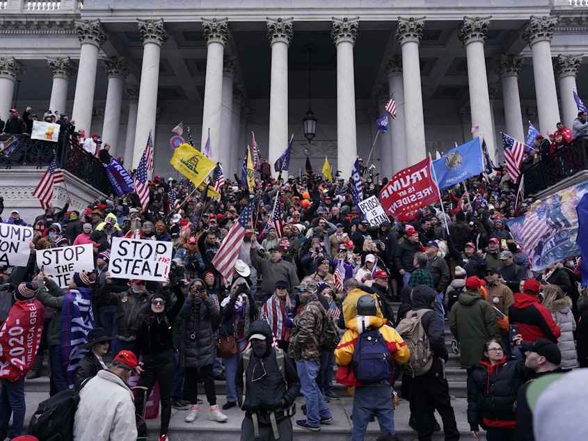 caption: Rioters take to the steps of the U.S. Capitol on Jan. 6. An NPR analysis found more Capitol riot defendants may have ties to the Oath Keepers, a far-right group, than was previously known.