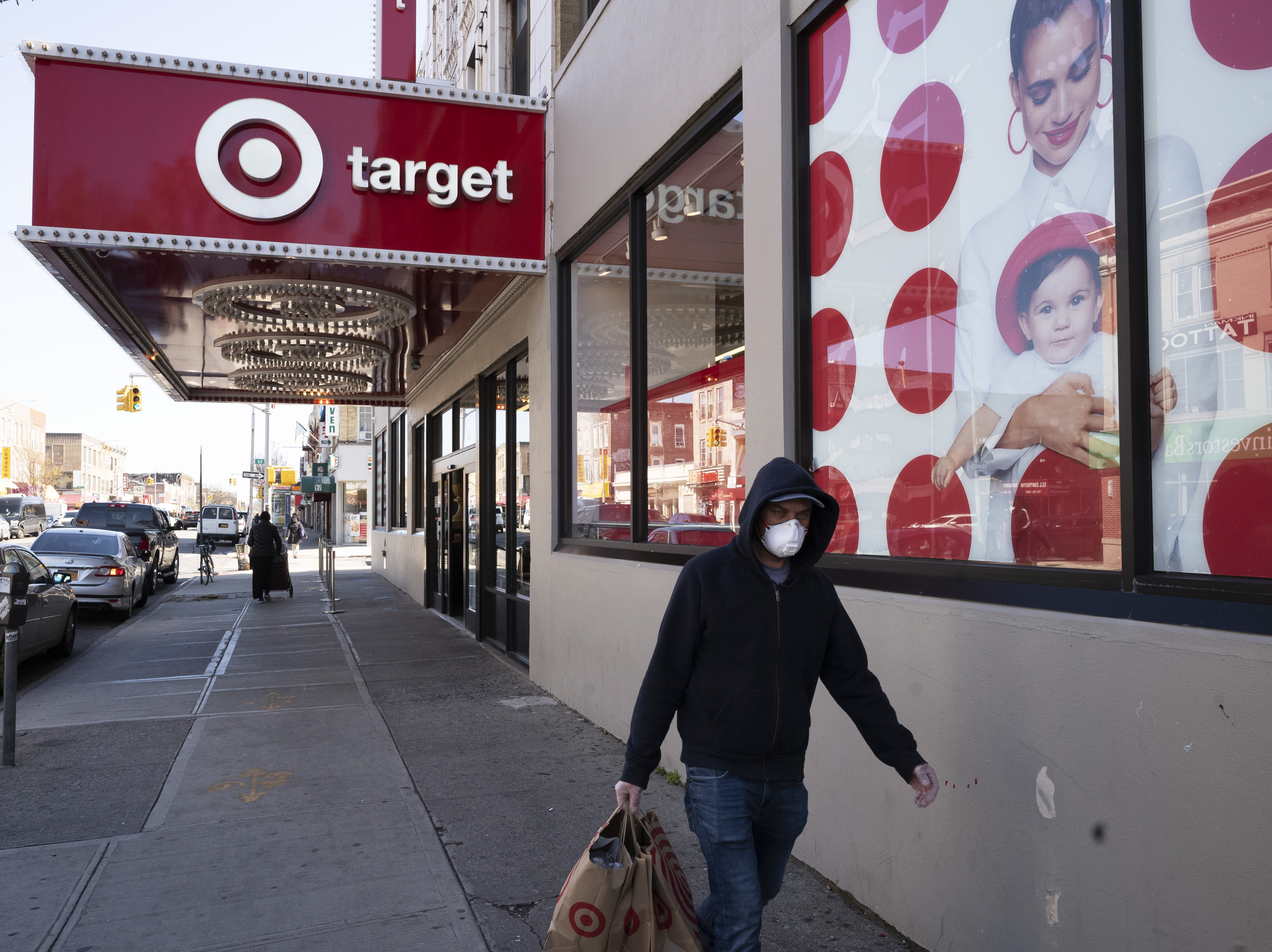 caption: Target said it would raise its minimum wage as high as $24 per hour.