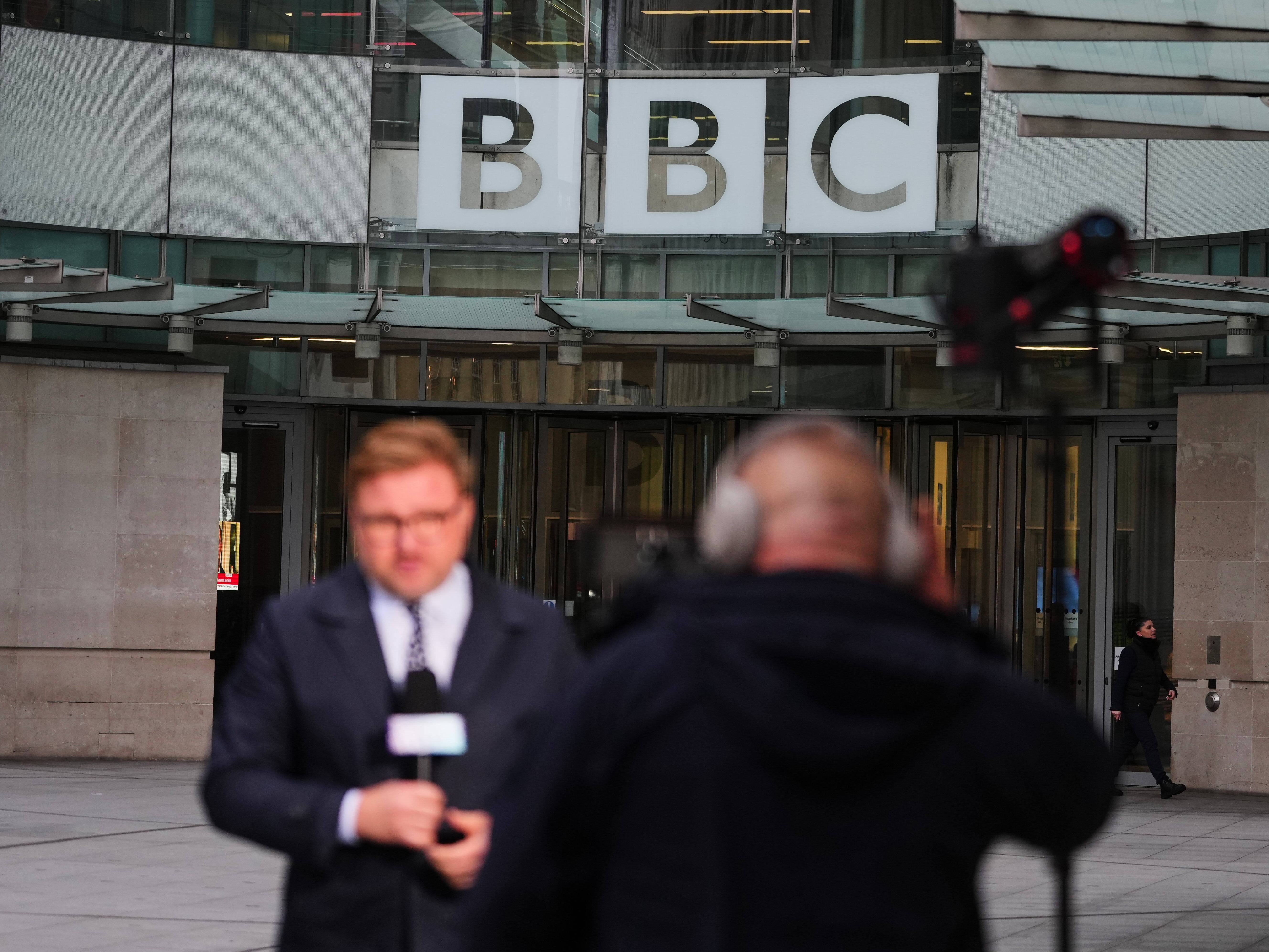 caption: Journalists report outside BBC Broadcasting House in London. In a new lawsuit, President Trump is seeking $10 billion from the BBC for defamation.
