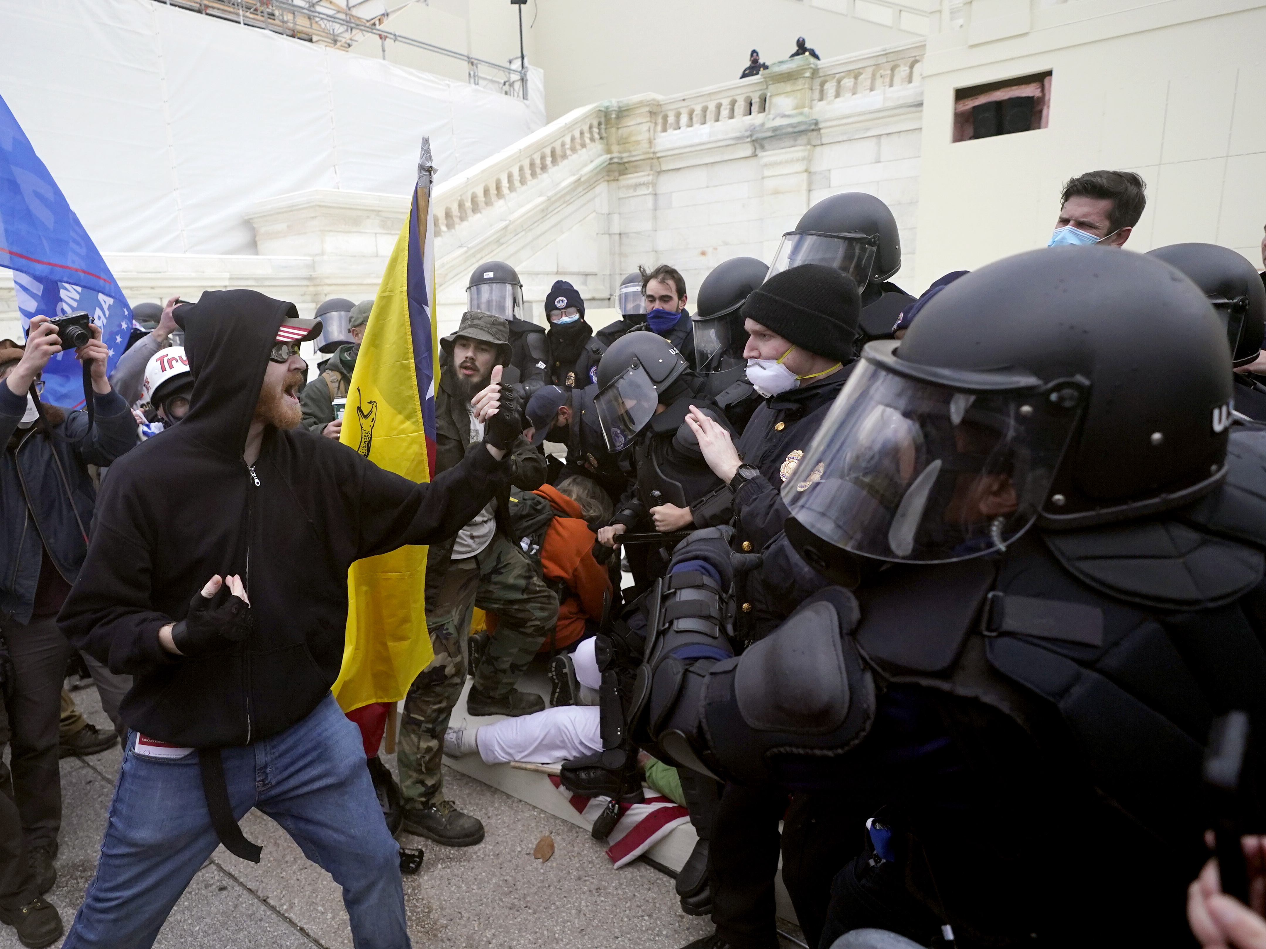 caption: Supporters of Donald Trump try to break through a police barrier at the U.S. Capitol on Jan. 6. The House will take up legislation Wednesday to create a select committee to investigate the insurrection.