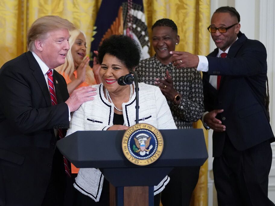 caption: Alice Marie Johnson, who had her sentence commuted by President Donald Trump after she served 21 years in prison for cocaine trafficking, speaks during a celebration of the First Step Act in the East Room of the White House Apr. 1, 2019.