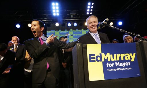 caption: Seattle mayoral candidate state Sen. Ed Murray, right, pauses while his husband, Michael Shiosaki, teases him after supporters called out Shiosaki's name at an election night party on Tuesday on Capitol Hill in Seattle.