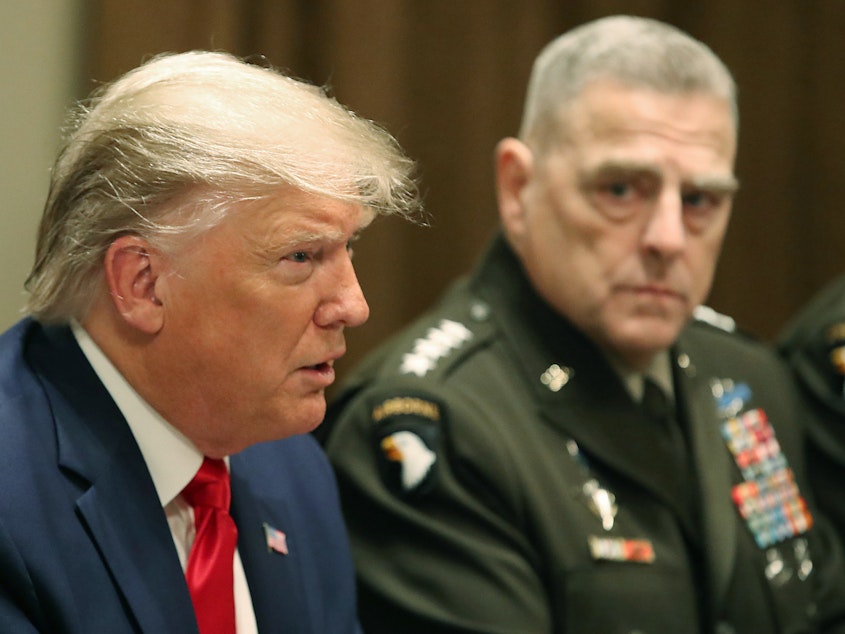 caption: Gen. Mark Milley, chairman of the Joint Chiefs of Staff, sought to reassure China's military that the U.S. wasn't planning an attack in the final months of former President Donald Trump's term in office, according to the book <em>Peril</em>.
