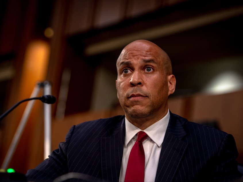 caption: Sen. Cory Booker, D-N.J., attends the second day of the Senate Judiciary Committee confirmation hearing for Supreme Court nominee Judge Amy Coney Barrett on Tuesday in Washington, D.C. (Hilary Swift-Pool/Getty Images)