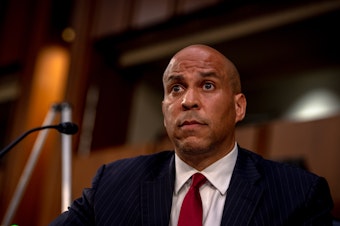 caption: Sen. Cory Booker, D-N.J., attends the second day of the Senate Judiciary Committee confirmation hearing for Supreme Court nominee Judge Amy Coney Barrett on Tuesday in Washington, D.C. (Hilary Swift-Pool/Getty Images)