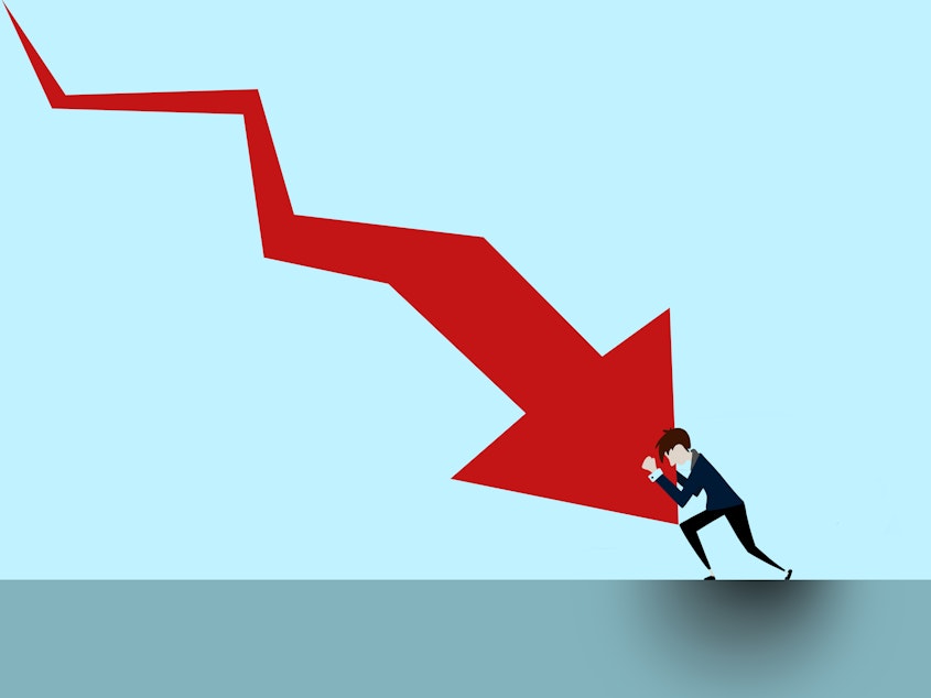 caption: Are we in a recession right now? Economists are divided.