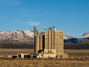 caption: The Smithfield feed processing mill producing food for nearby hog-raising farms in Milford, Utah.