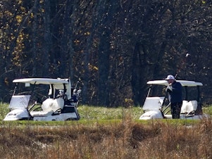 caption: President Donald Trump participates in a round of golf at the Trump National Golf Course on Saturday, Nov. 7, 2020, in Sterling, Va.