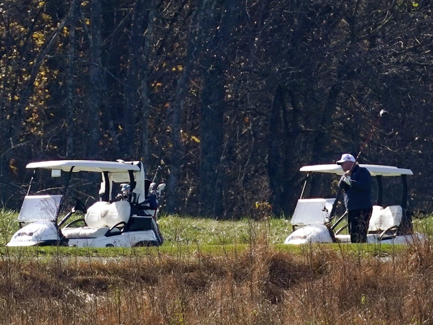 caption: President Donald Trump participates in a round of golf at the Trump National Golf Course on Saturday, Nov. 7, 2020, in Sterling, Va.