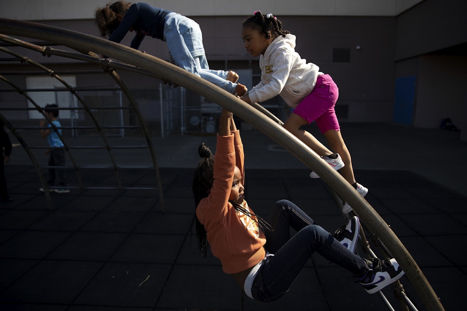 caption: Malayew Washington, a 1st-grade-student at Jennie Reed Elementary, plays with classmates during recess on Monday, September 26, 2022, in Tacoma. 