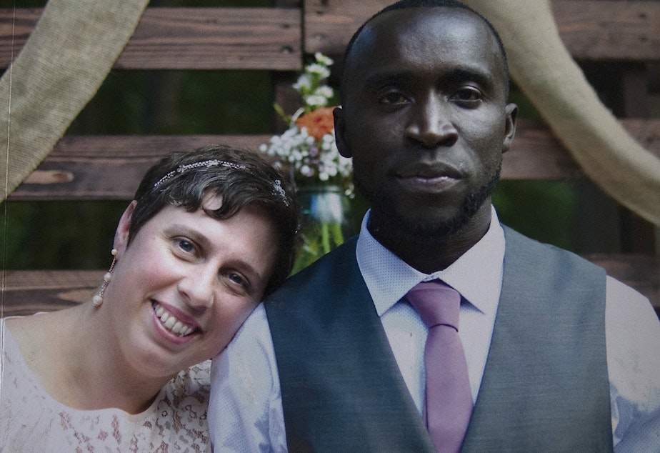 caption: A picture of Rebecca and Bangally Fatty on their wedding day is shown in a photo album on Tuesday, November 14, 2017, in Seattle.