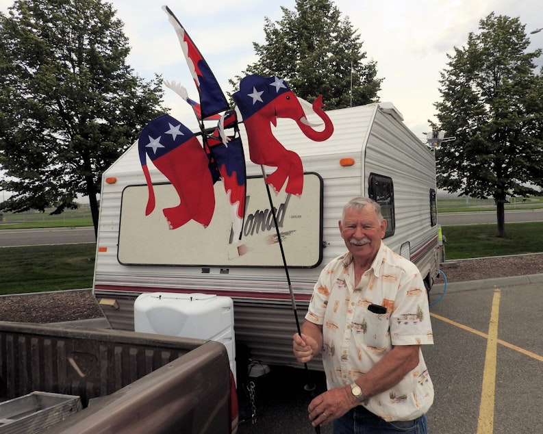 caption: Len Liendsley gets his space set up outside the TRAC Convention Center in Pasco, site of the state Republican convention. 'I just love the party. ... not totally in love with it this year,' he says.
