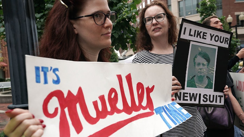 caption: Activists protest outside the federal courthouse in Alexandria, Va., on July 31, 2018, the first day of the trial of former Trump campaign chairman Paul Manafort.