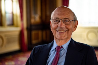 caption: Justice Stephen Breyer welcomes the resumption of in-person oral arguments at the high court this fall.