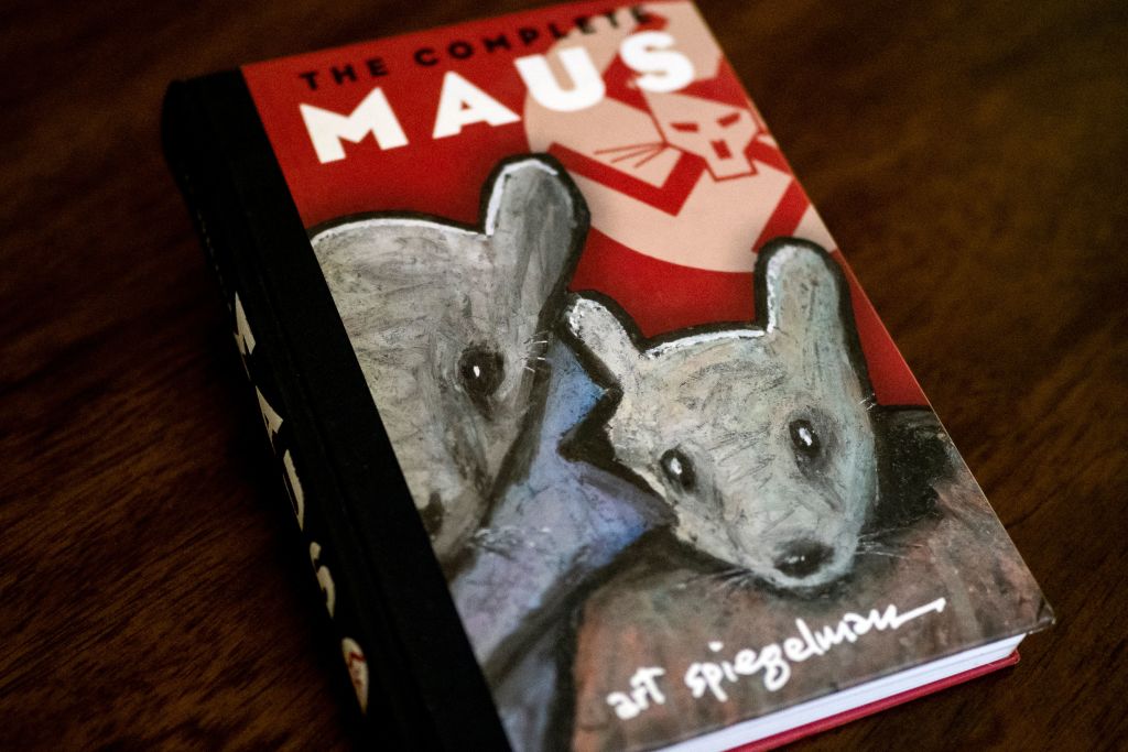 caption: The cover of the graphic novel "Maus" by Art Spiegelman. A school board in Tennessee has added to a surge in book bans by conservatives with an order to remove the award-winning 1986 graphic novel on the Holocaust, "Maus," from local student libraries. Author Art Spiegelman told CNN on January 27 — coincidentally International Holocaust Remembrance Day — that the ban of his book for crude language was "myopic" and represents a "bigger and stupider" problem than any with his specific work. (Maro Siranosian/ 