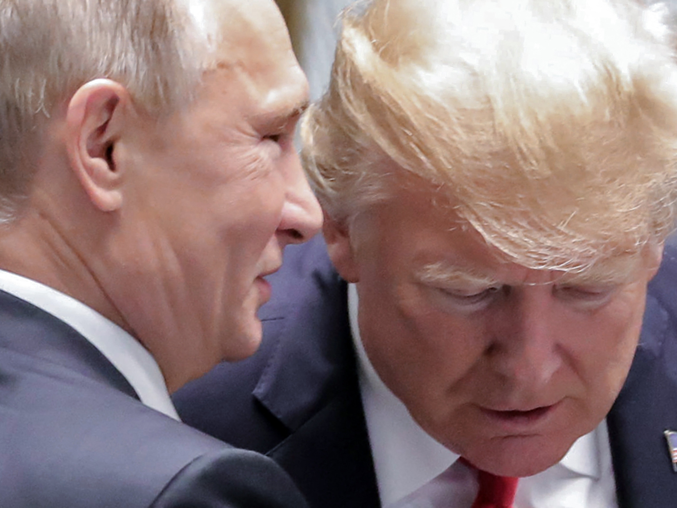 caption: Russian President Vladimir Putin and President Trump talk during the Asia-Pacific Economic Cooperation (APEC) leaders' summit in Danang, Vietnam on Nov. 11, 2017.
