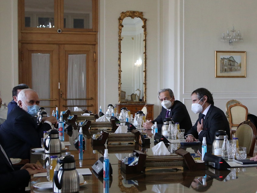 caption: Director General of the International Atomic Energy Agency (IAEA) Rafael Mariano Grossi meets over the weekend with Iranian Foreign Minister Mohammad Javad Zarif.