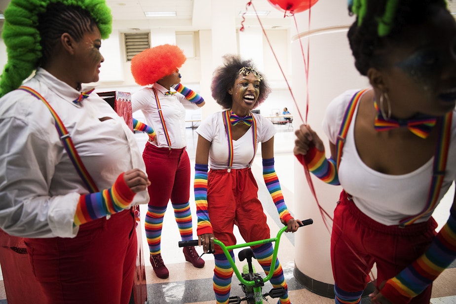 caption: Sarabia Freeman Edwards, second from right, laughs while waiting backstage with Mr. Naturalz Salon team members during the 7th annual Reign of Style Hair Show and Competition on Sunday, March 3, 2019, at the Seattle Center Exhibition Hall on Mercer Street in Seattle. 