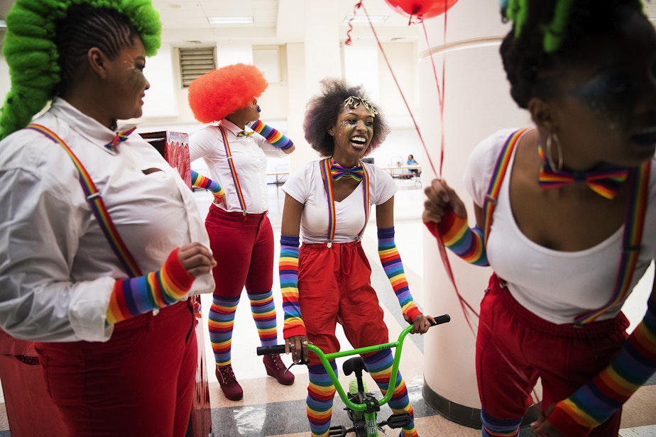 caption: Sarabia Freeman Edwards, second from right, laughs while waiting backstage with Mr. Naturalz Salon team members during the 7th annual Reign of Style Hair Show and Competition on Sunday, March 3, 2019, at the Seattle Center Exhibition Hall on Mercer Street in Seattle.