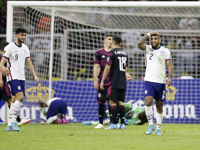 caption: United States defender DeAndre Yedlin (2) reacts after United States forward Christian Pulisic (10) and Mexico goalkeeper Guillermo Ochoa (13) collide in the first half at Estadio Azteca on Thursday.