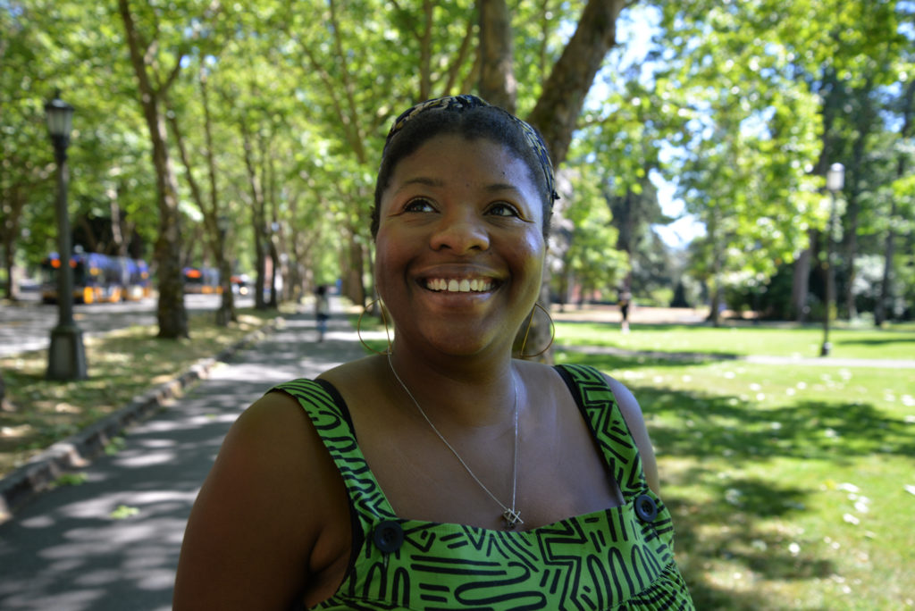 caption: Erika Davis has helped birth over twenty babies over her six years as a doula. She's part of a growing movement to advocate for mothers and families before, during, and after the birthing process.