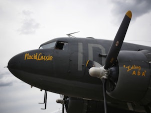 caption: D-Day veteran C-47 Placid Lassie sits on the flight line at England's Imperial War Museum Duxford.