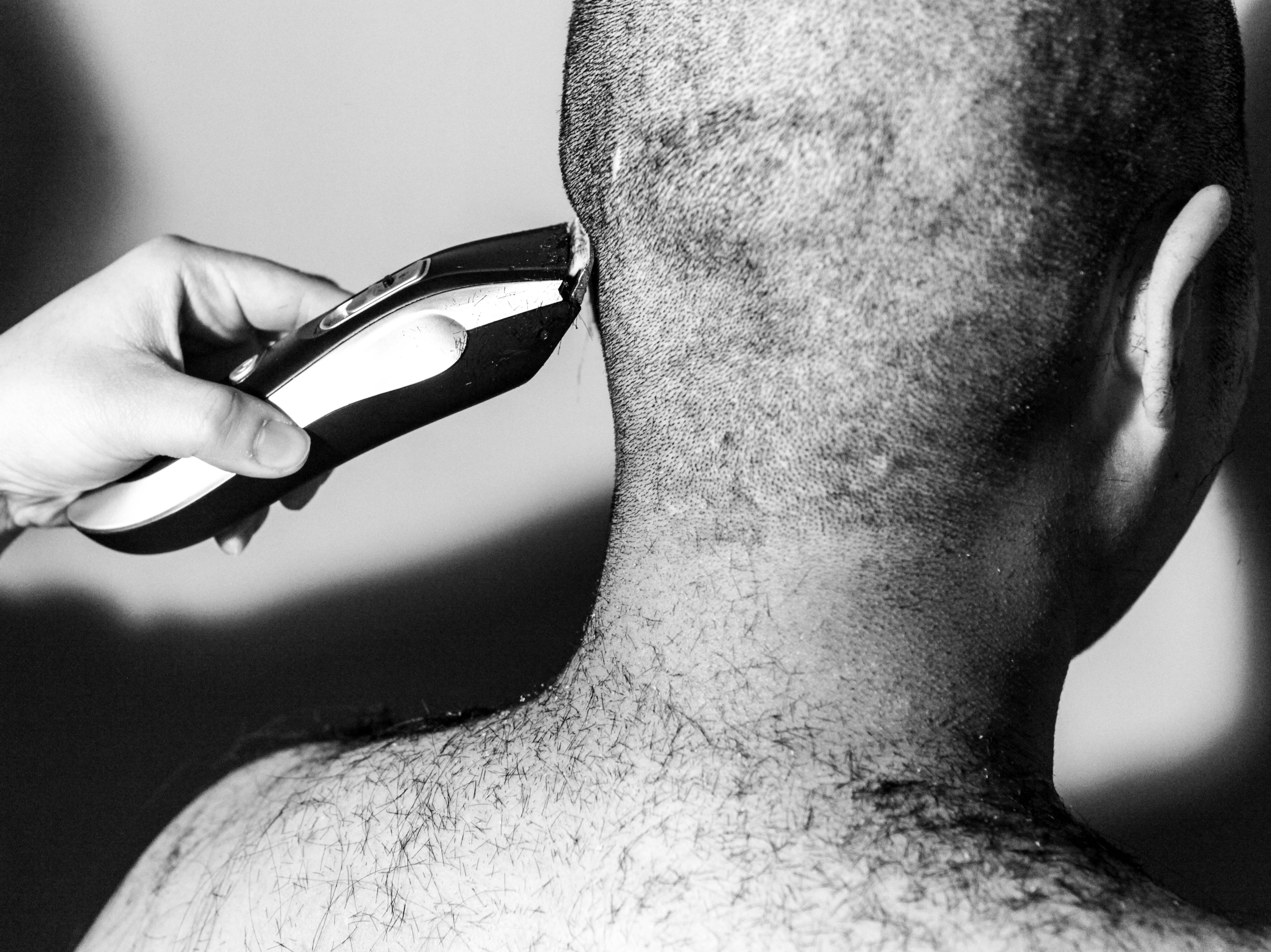 caption: A South Korean woman has her head shaved in a photograph taken by Jeon Bora. Having short hair and no makeup is a common symbol of the "escape the corset" movement, which aims to reject South Korea's standards of beauty and social pressure to conform. Bora's photographs document the women involved in this movement in stark black-and-white images.