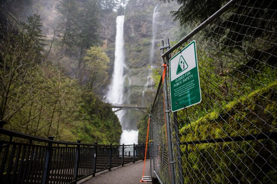 caption: <p>"Closed" signs mark off parts of Multnomah Falls, April 13, 2018.</p>