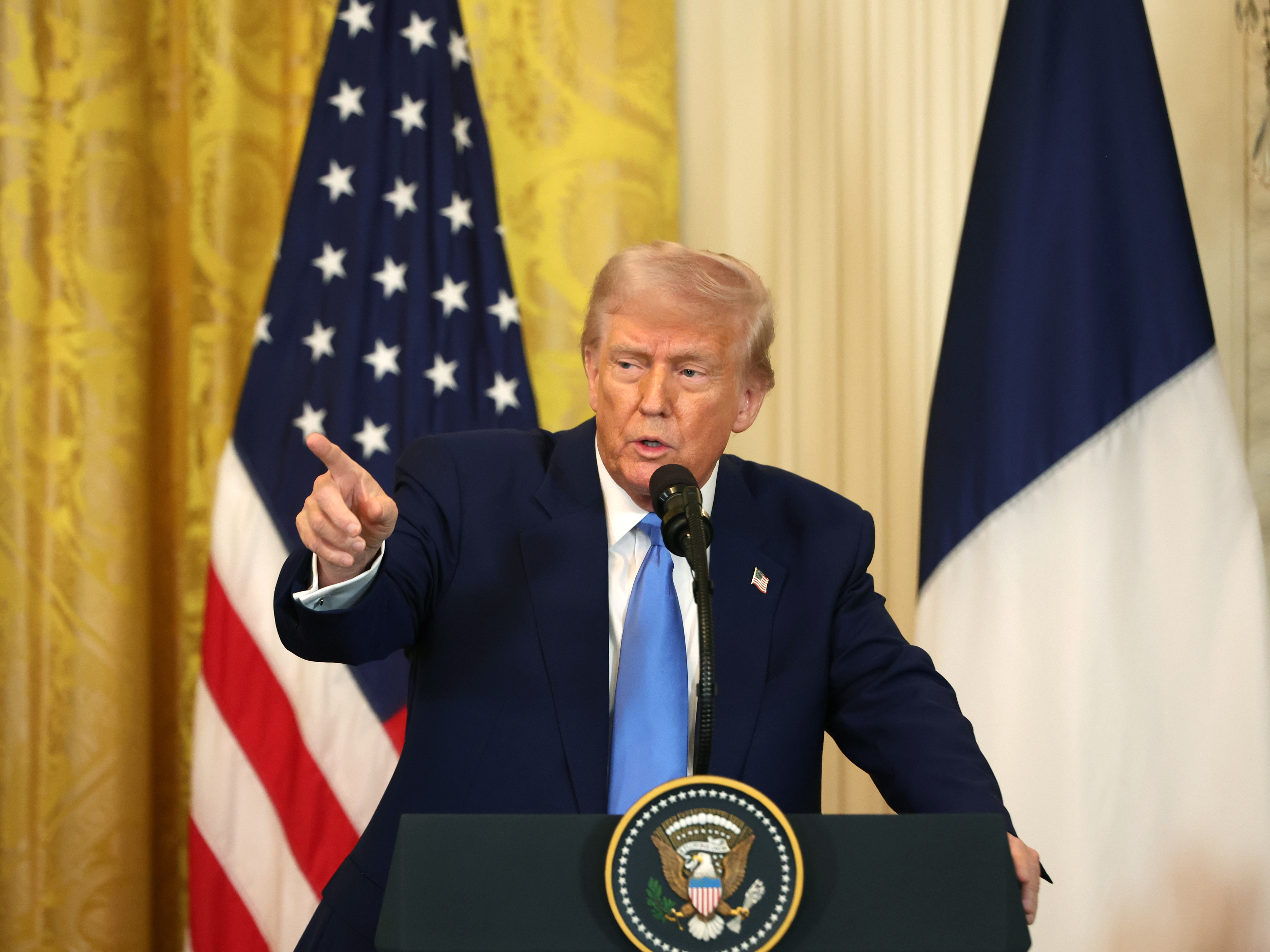 caption: President Trump delivers remarks during a joint news conference in the East Room at the White House on Feb. 24.