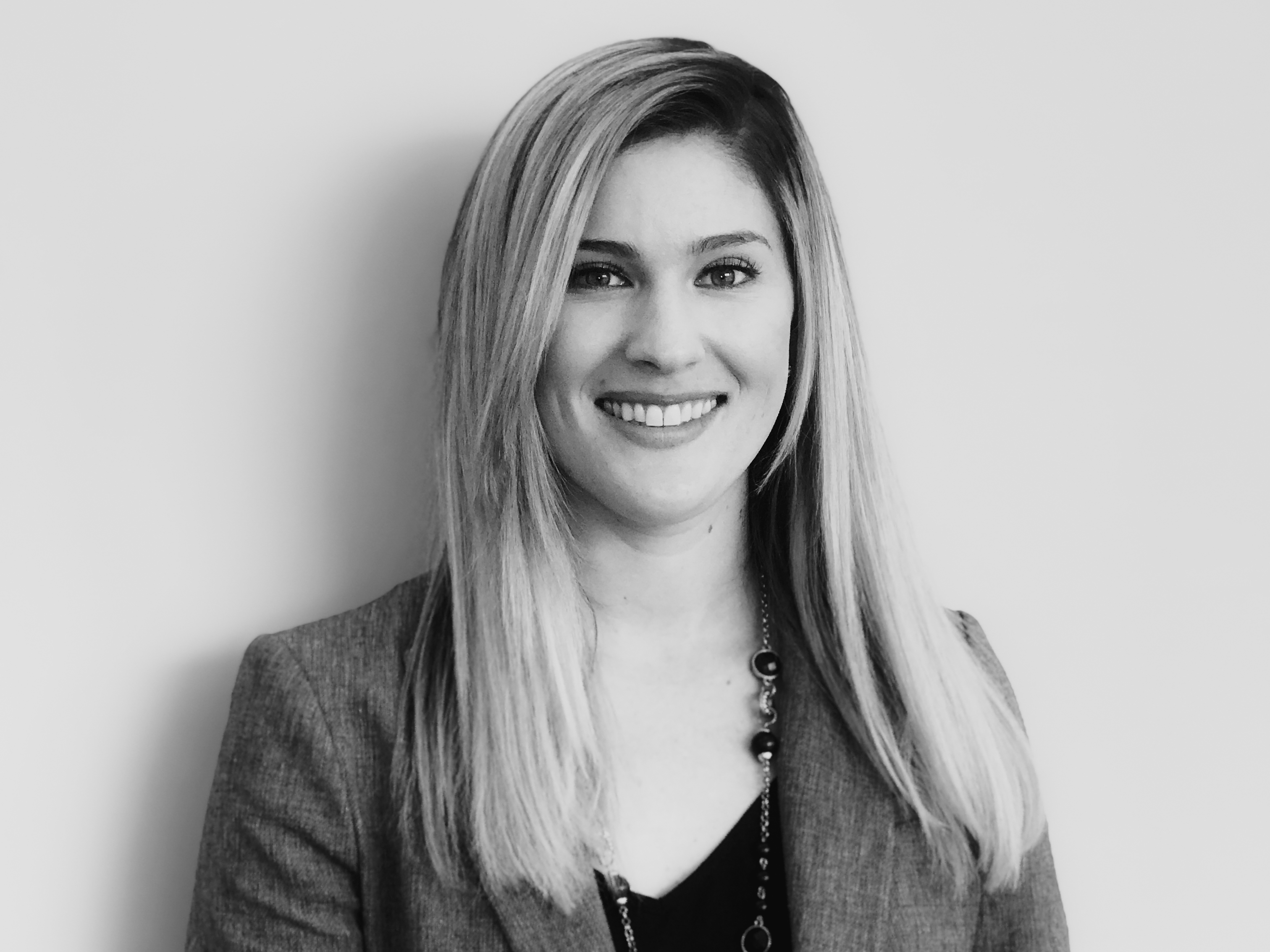 caption: When Kelly O'Brien went to work at Fidelity Investments a year and a half ago, she was excited to learn the company would contribute to her student loan payments.