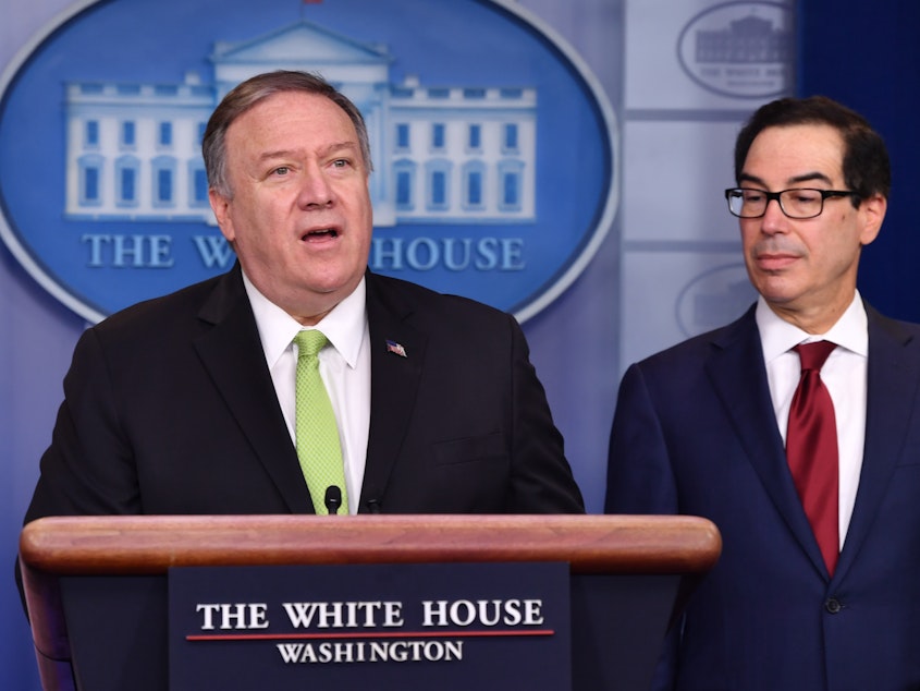 caption: Secretary of State Mike Pompeo and Treasury Secretary Steven Mnuchin announce new sanctions on Iran at the White House on Friday.