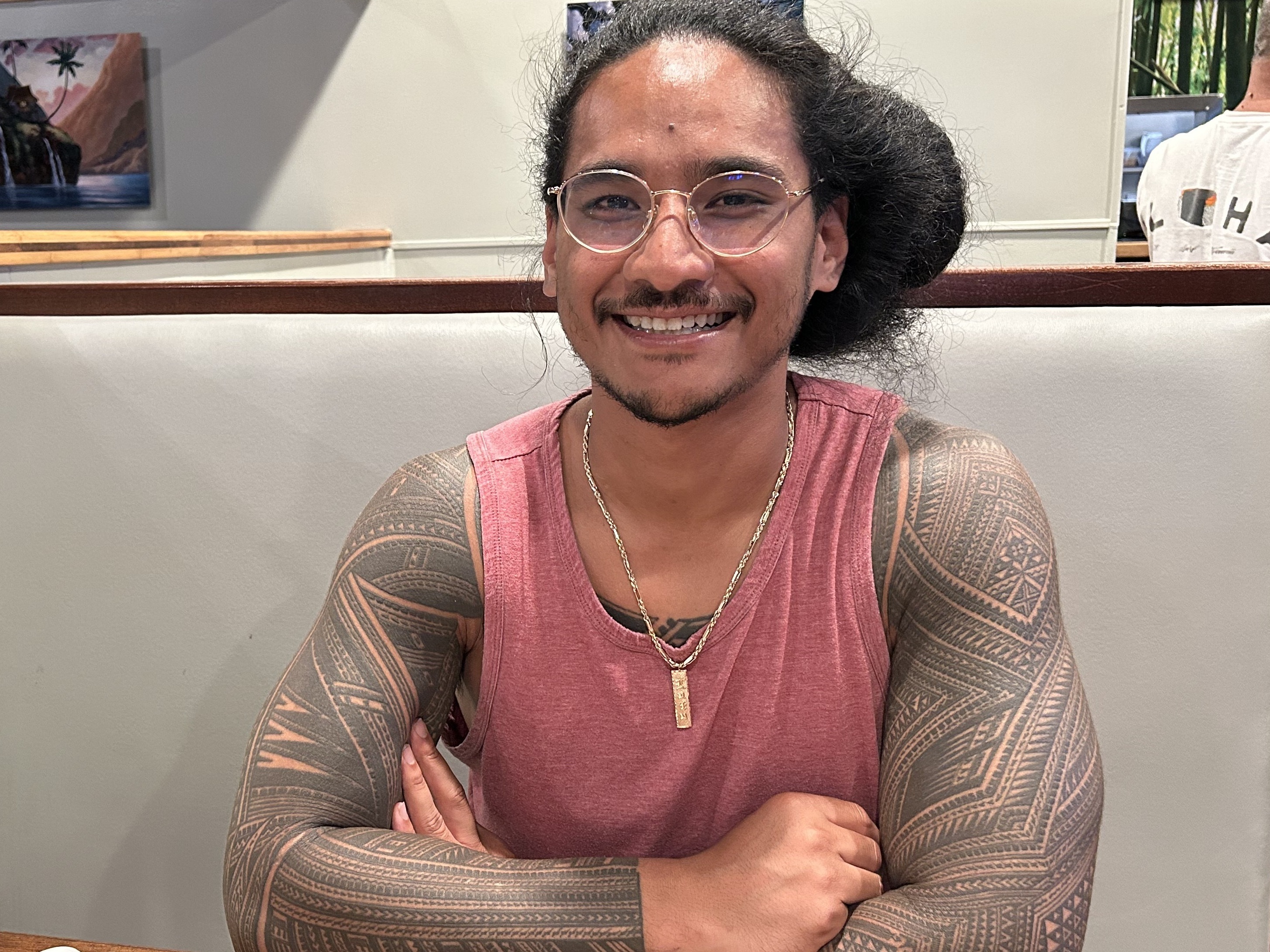 caption: Kian Lutu rushed to Maui to help find his grandfather. As people followed his story on social media, they started sending him money through Venmo.