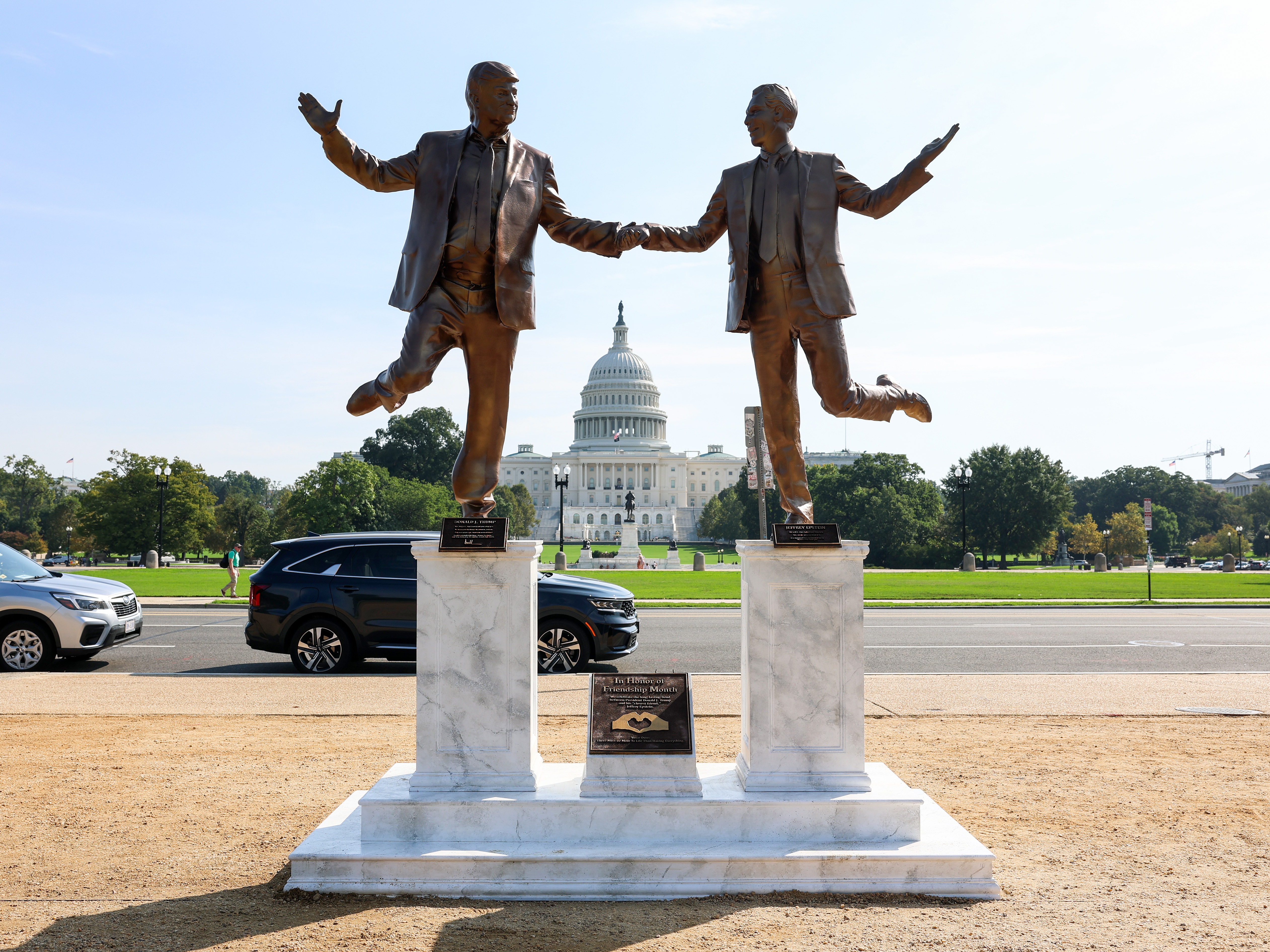 caption: A statue depicting President Trump and convicted sex offender Jeffrey Epstein holding hands popped up near the U.S. Capitol on Tuesday.