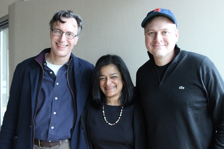 caption: 'Week in Review' panel Bill Radke, Pramila Jayapal and Luke Burbank. Not pictured: Michael Baumgartner
