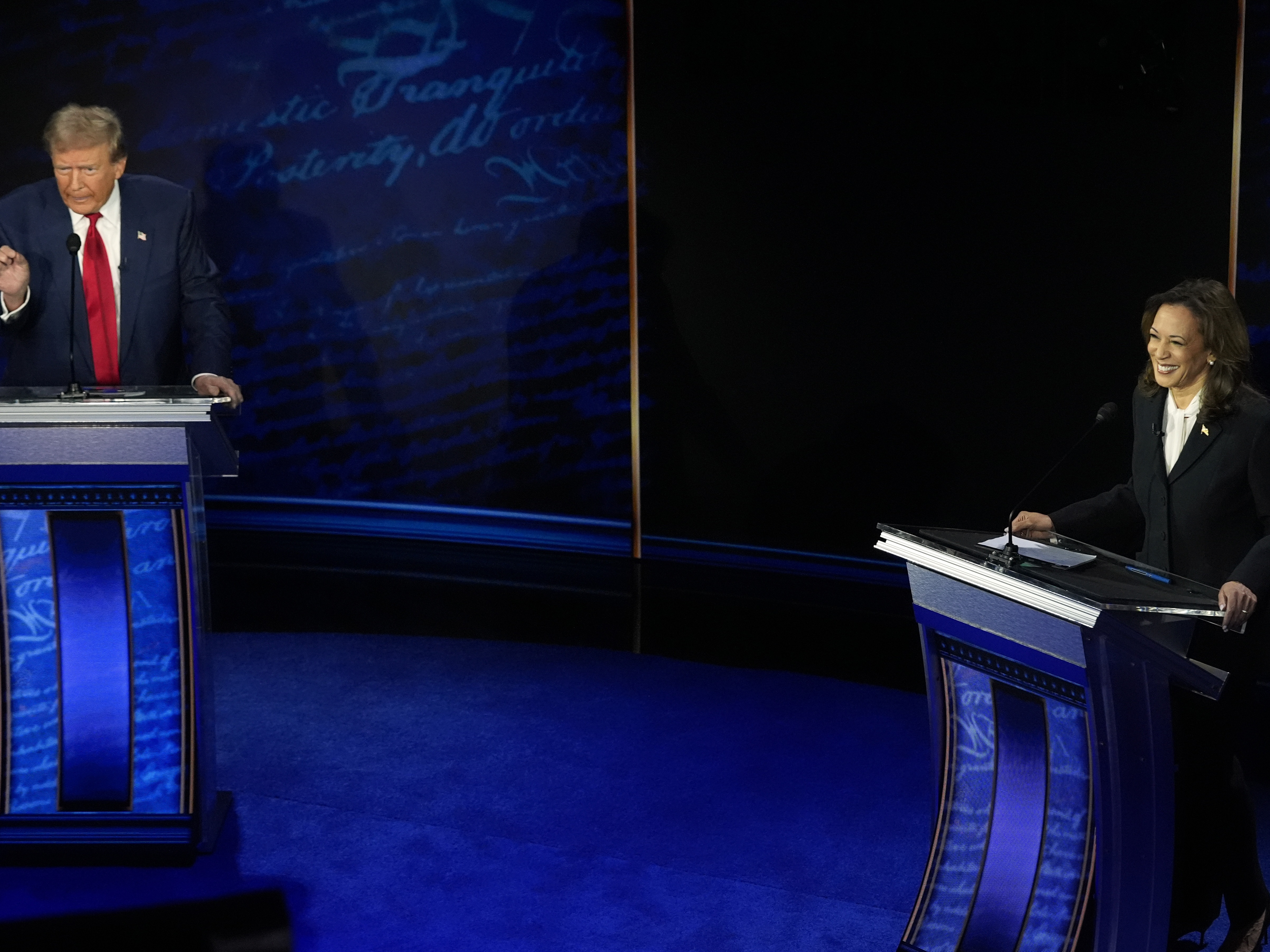 caption: Republican presidential nominee former President Donald Trump and Democratic presidential nominee Vice President Kamala Harris participate during an ABC News presidential debate at the National Constitution Center, Tuesday, Sept.10, 2024, in Philadelphia.