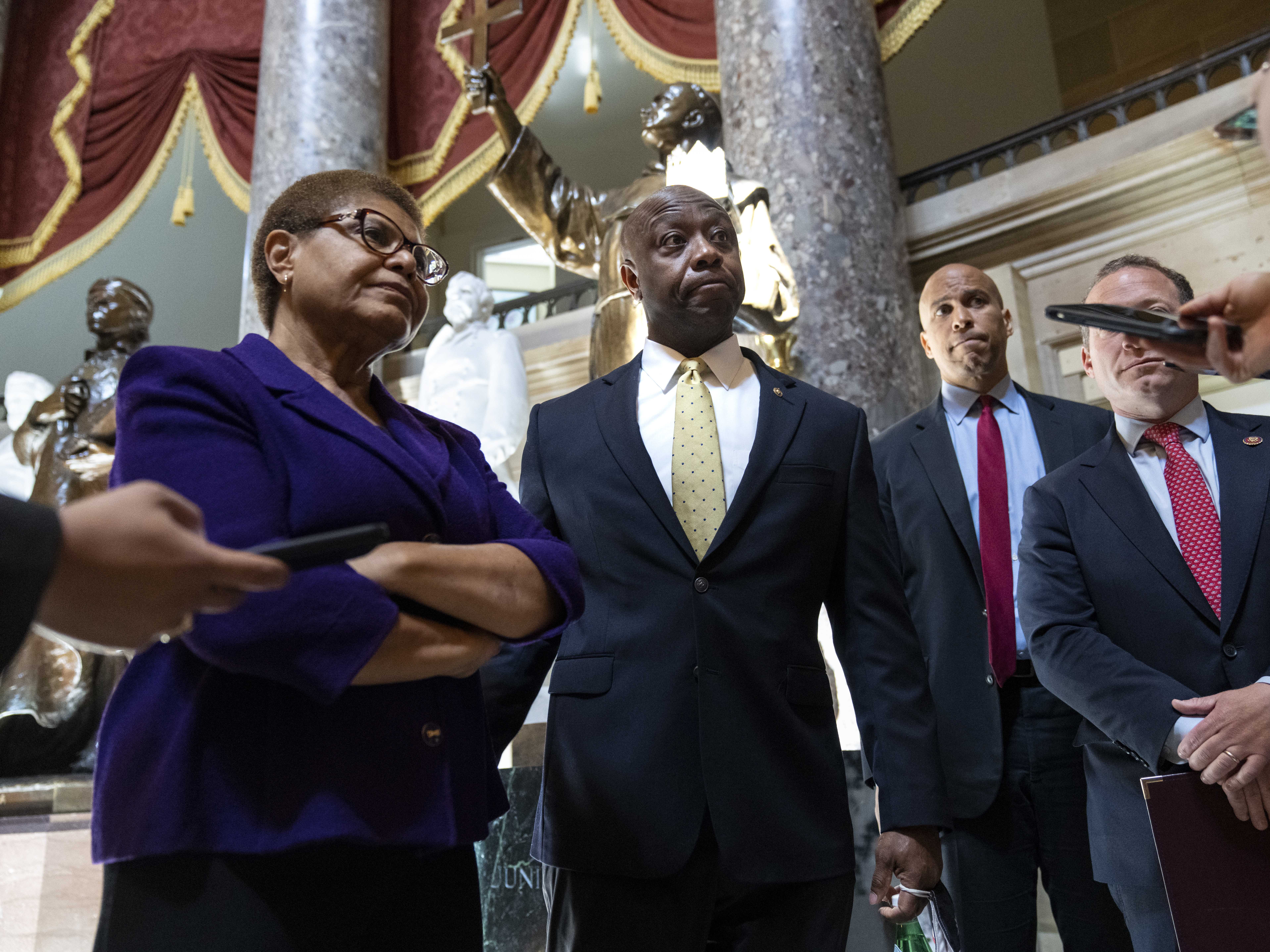 caption: Rep. Karen Bass, D-Calif., Sen. Tim Scott, R-S.C., and Sen. Cory Booker, D-N.J. have been leading bipartisan negotiations over policing reform for months. Those talks have now ended with no agreement.