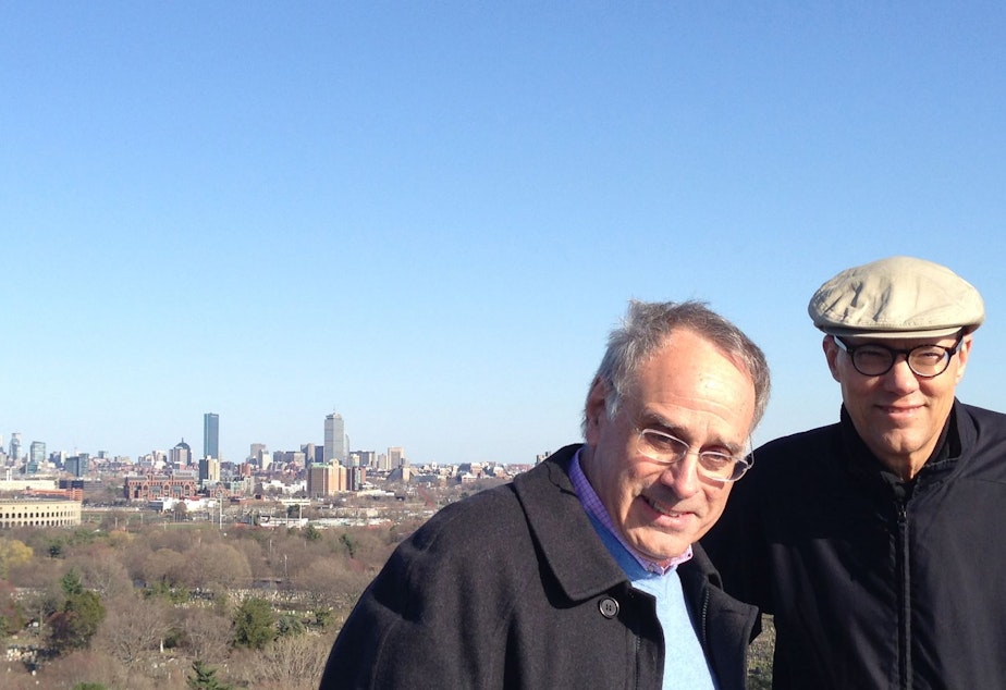 caption: Richard Sher, host of 'Says You,' left, and KUOW Programming Director Jeff Hansen in the spring of 2014. They are standing on Sher's favorite spot in a gated cemetery in Boston.