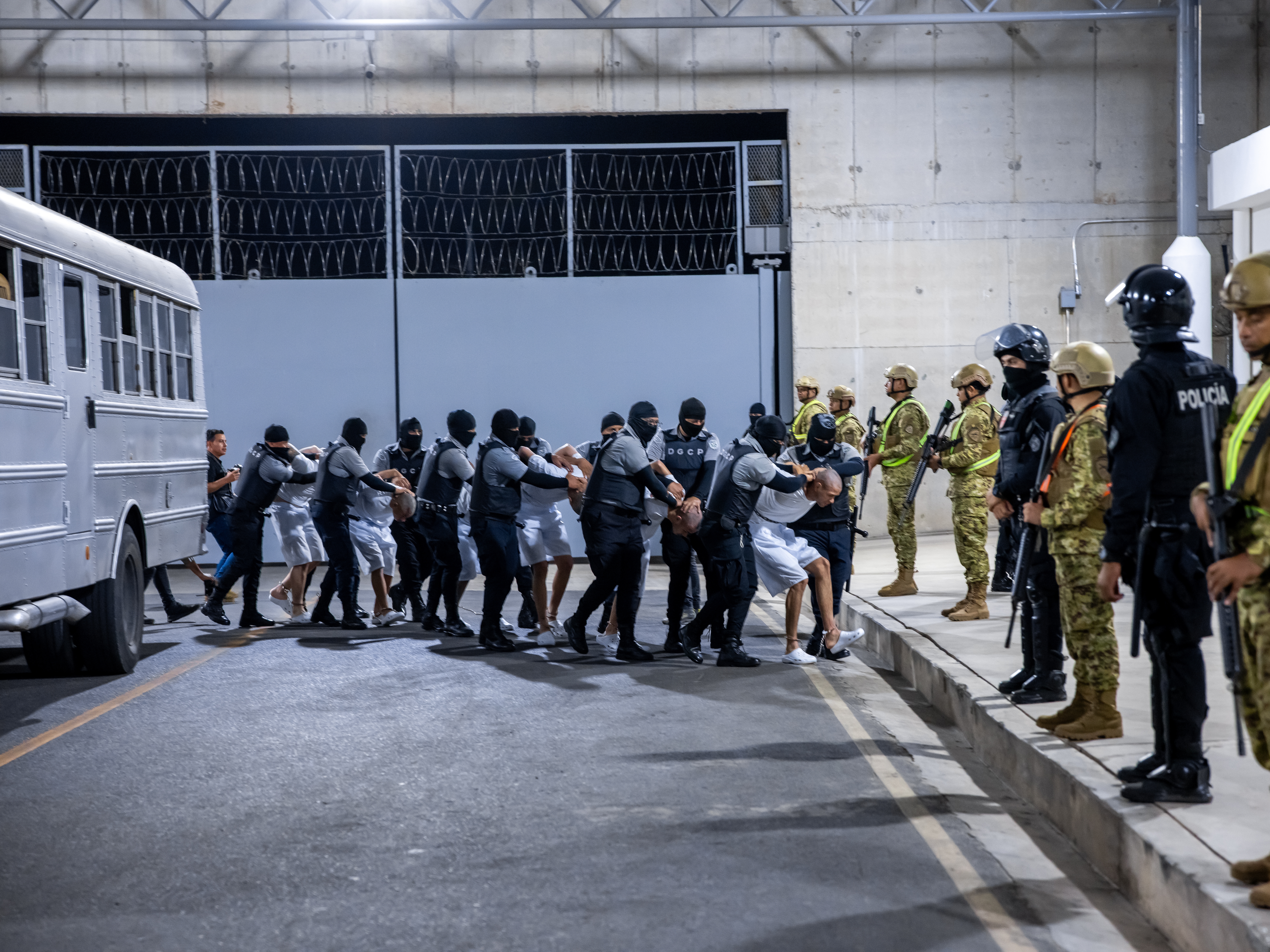 caption: 17 alleged members of Venezuela's Tren de Aragua gang and members of the MS-13 gang, who were deported to El Salvador by the US in San Salvador, El Salvador on March 31, 2025.